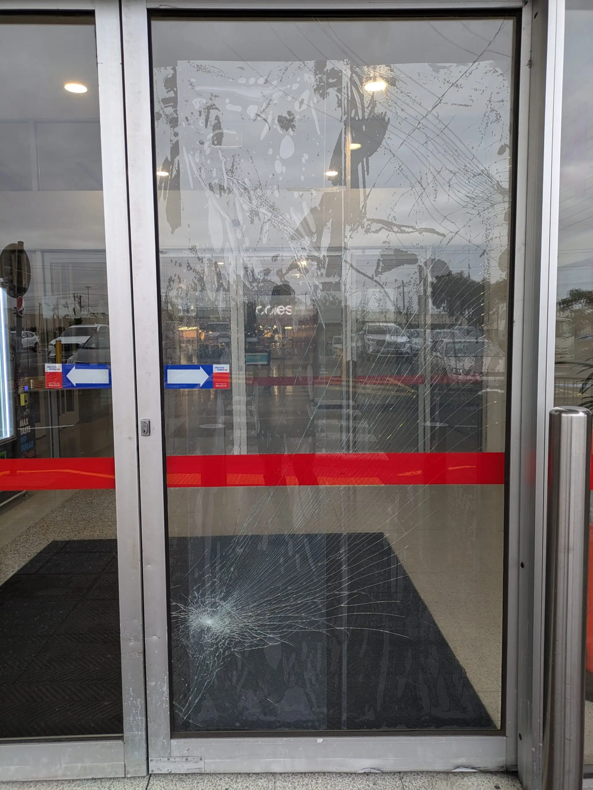 Broken glass door with protective film